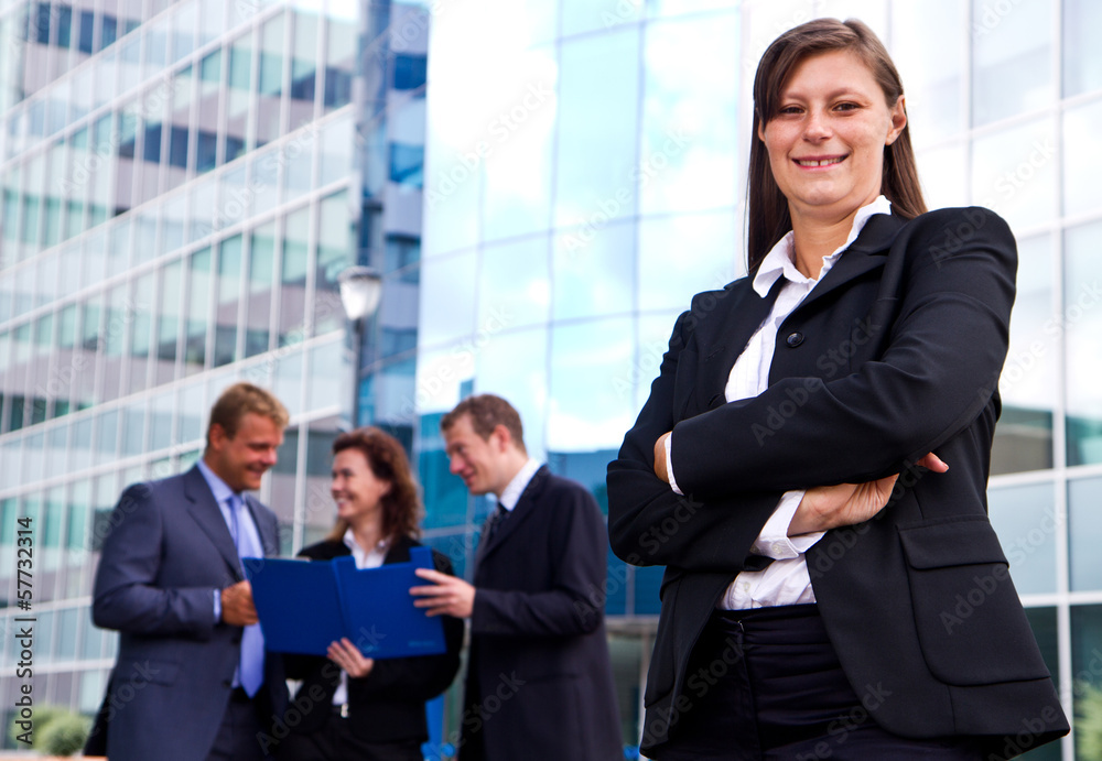 Group of business people with businesswoman leader on foreground Group of business people with businesswoman leader on foreground