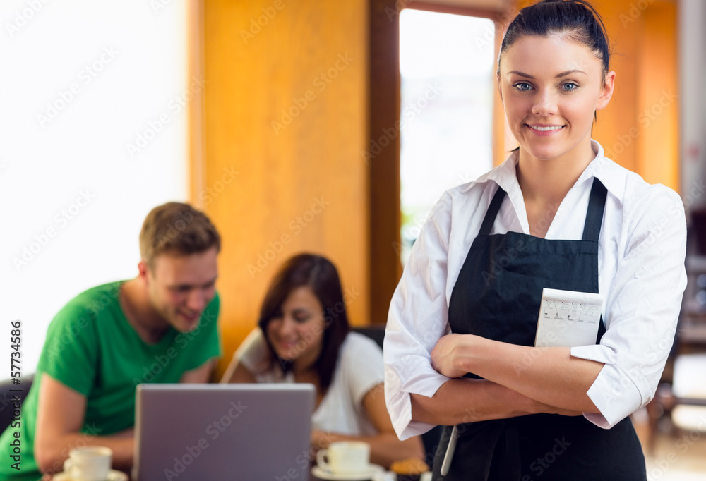 Waitress with two students using laptop at coffee shop Waitress with two students using laptop at coffee shop