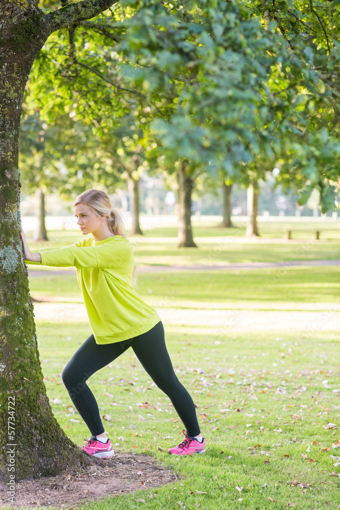 Fit pretty blonde stretching legs