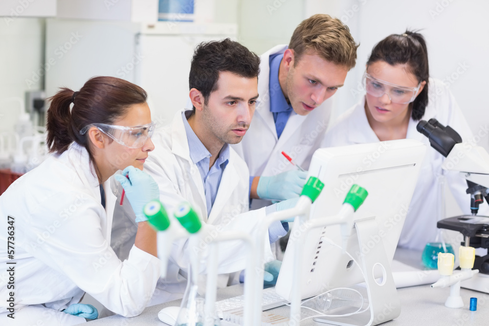 Researchers looking at computer screen in the lab Researchers looking at computer screen in the lab