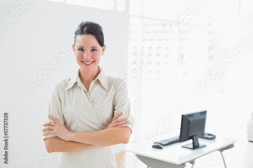 Elegant and smiling businesswoman in the office