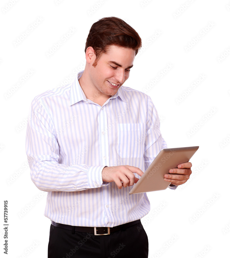 Handsome redhead male using his tablet pc Handsome redhead male using his tablet pc