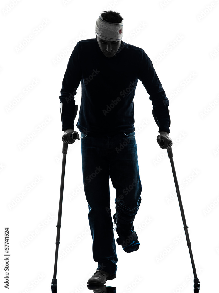 injured man walking with crutches silhouette injured man walking with crutches silhouette