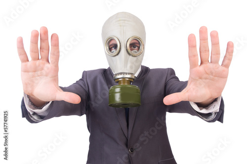 Businessman wearing gas mask isolated on white © Elnur