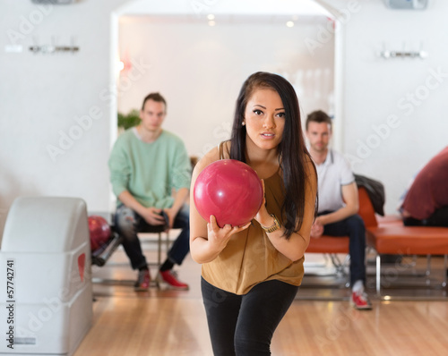 Woman With Ball Bowling in Club