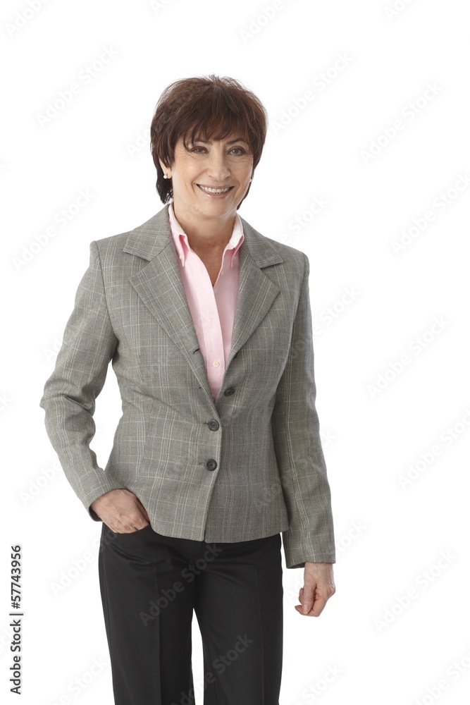 Senior businesswoman standing with hand in pocket Senior businesswoman standing with hand in pocket