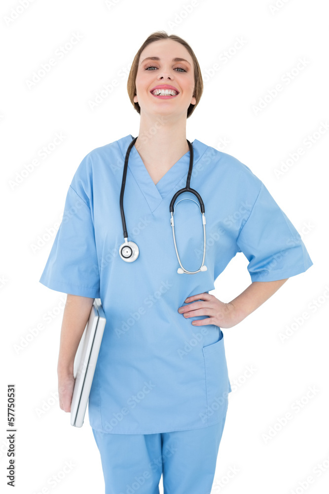 Young female doctor holding a notebook and laughing into the cam Young female doctor holding a notebook and laughing into the cam