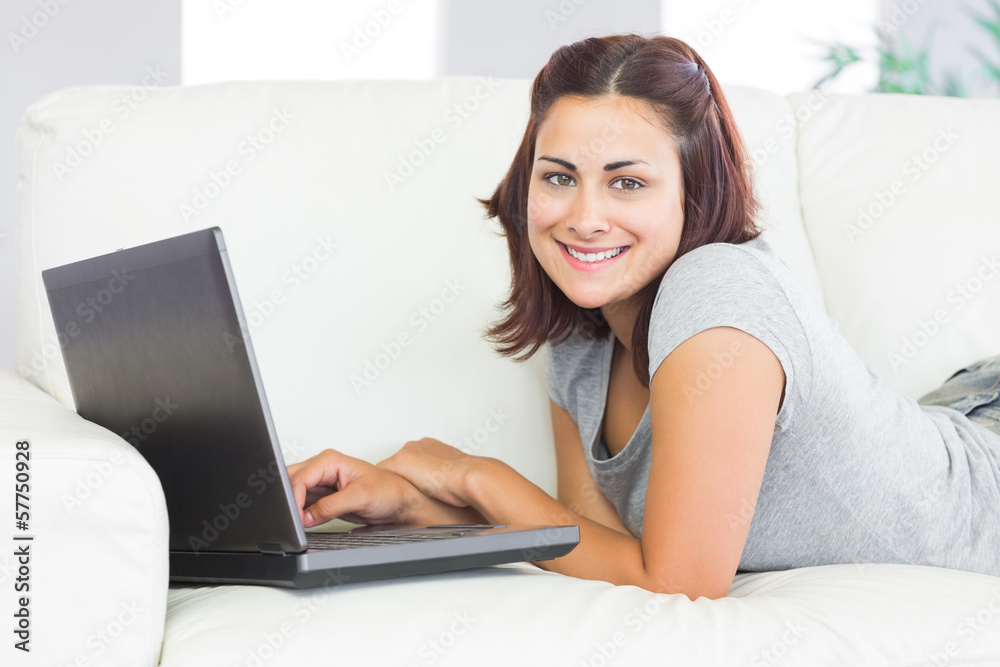 Portrait of cute brunette woman working with her notebook Portrait of cute brunette woman working with her notebook