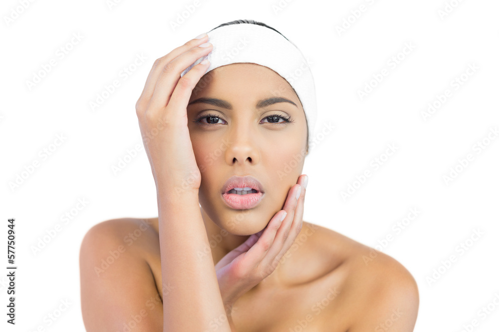 Stern nude brunette with hairband touching head Stern nude brunette with hairband touching head
