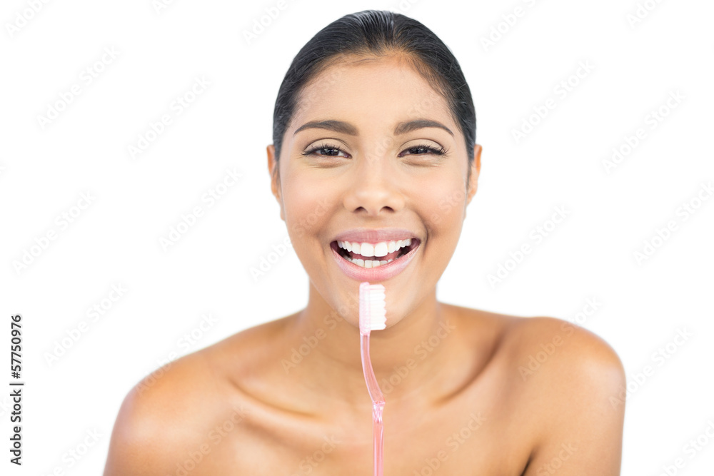 Cheerful nude brunette holding toothbrush Cheerful nude brunette holding toothbrush