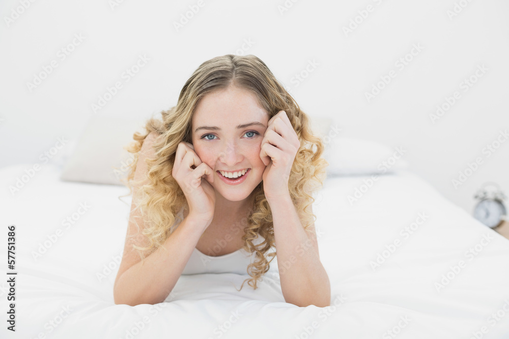 Pretty lucky blonde lying on bed looking at camera Pretty lucky blonde lying on bed looking at camera