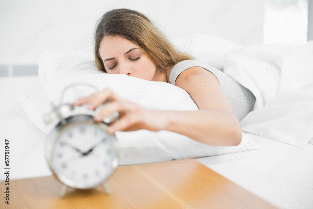 Calm brunette woman lying on her bed with eyes closed Calm brunette woman lying on her bed with eyes closed