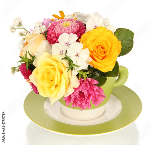 Beautiful bouquet of bright flowers in color mug  isolated