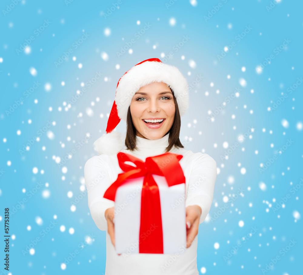 smiling woman in santa helper hat with gift box smiling woman in santa helper hat with gift box
