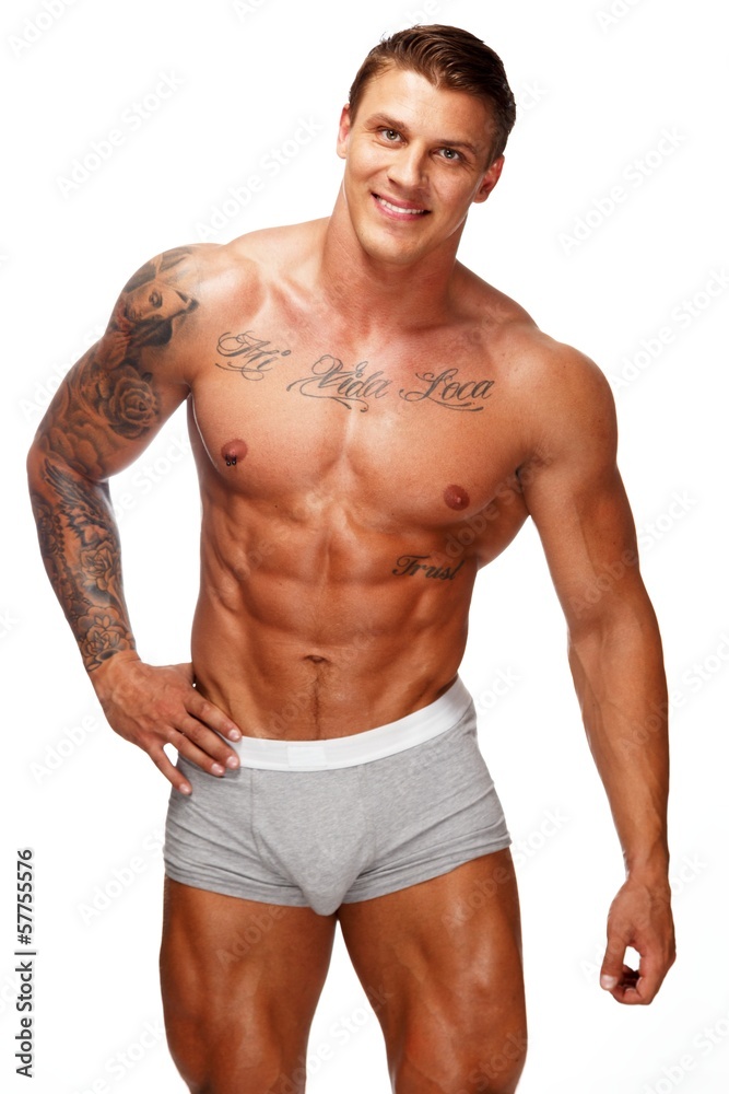 Man with beautiful muscular tattooed torso in underwear
