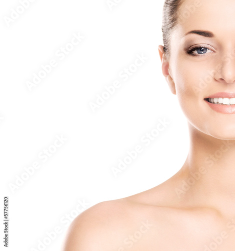 Close-up portrait of a beautiful woman in makeup on white