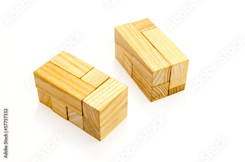 A wooden cube puzzle over white