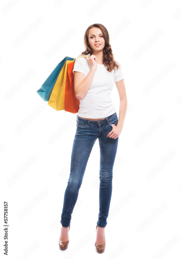An attractive and happy shopping girl with shopping bags An attractive and happy shopping girl with shopping bags
