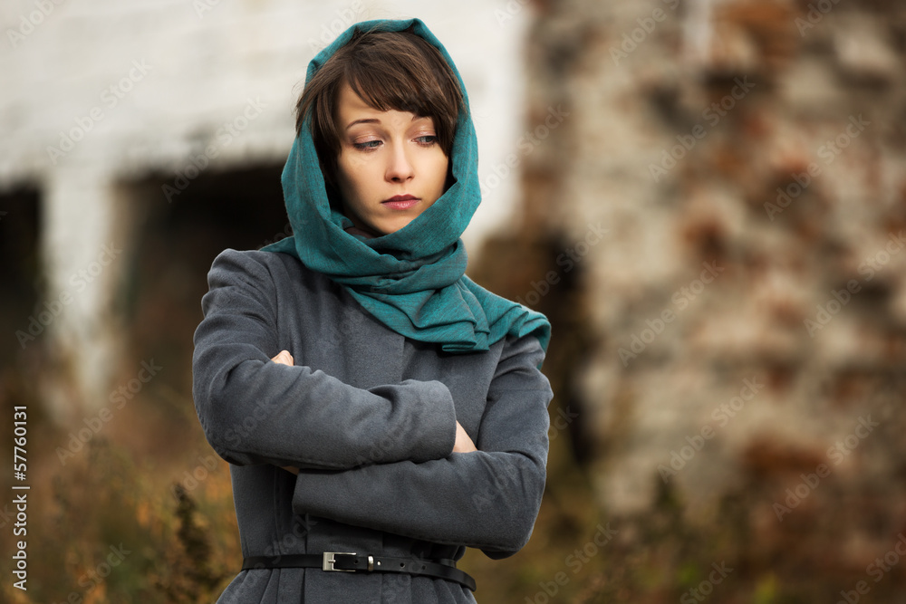 Sad young woman in grey classic coat Sad young woman in grey classic coat