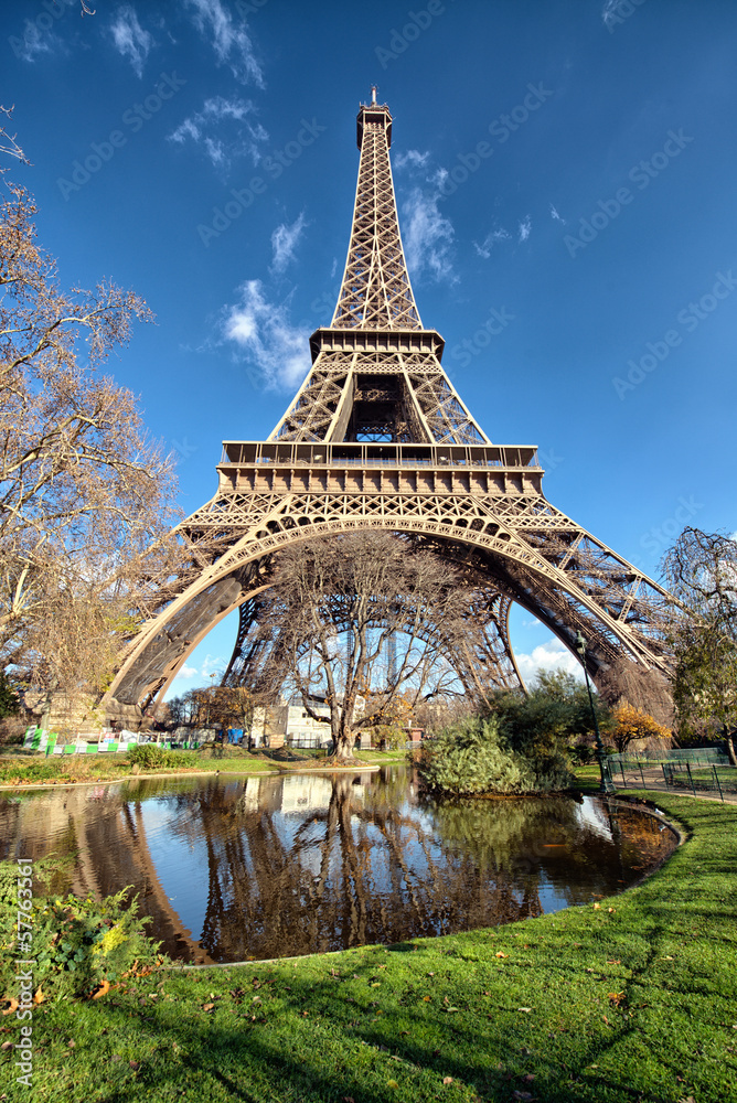 Wonderful wide angle view of Eiffel Tower with lake and vegetati