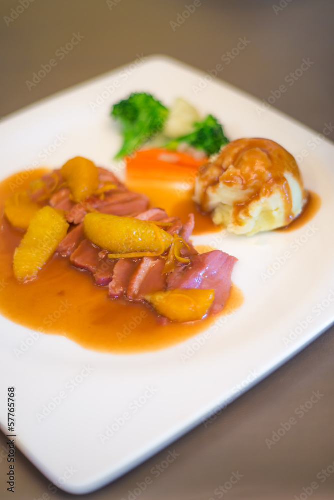 Cooked sliced ham served with grinded potato Cooked sliced ham served with grinded potato
