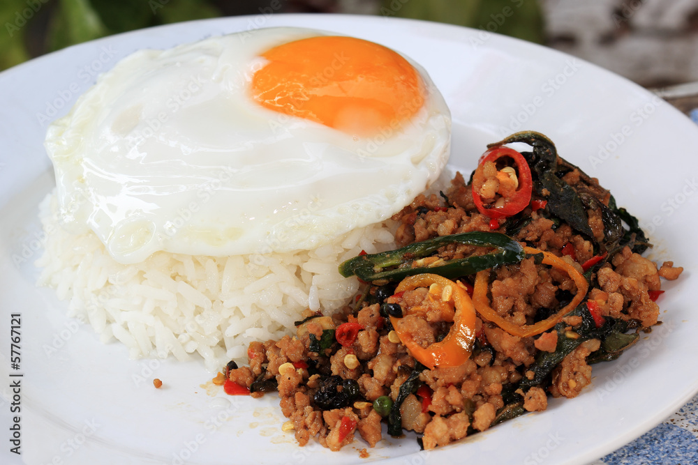 Pad Krapao Moo, spicy stir-fried pork with Thai Holy basil and c Pad Krapao Moo, spicy stir-fried pork with Thai Holy basil and c