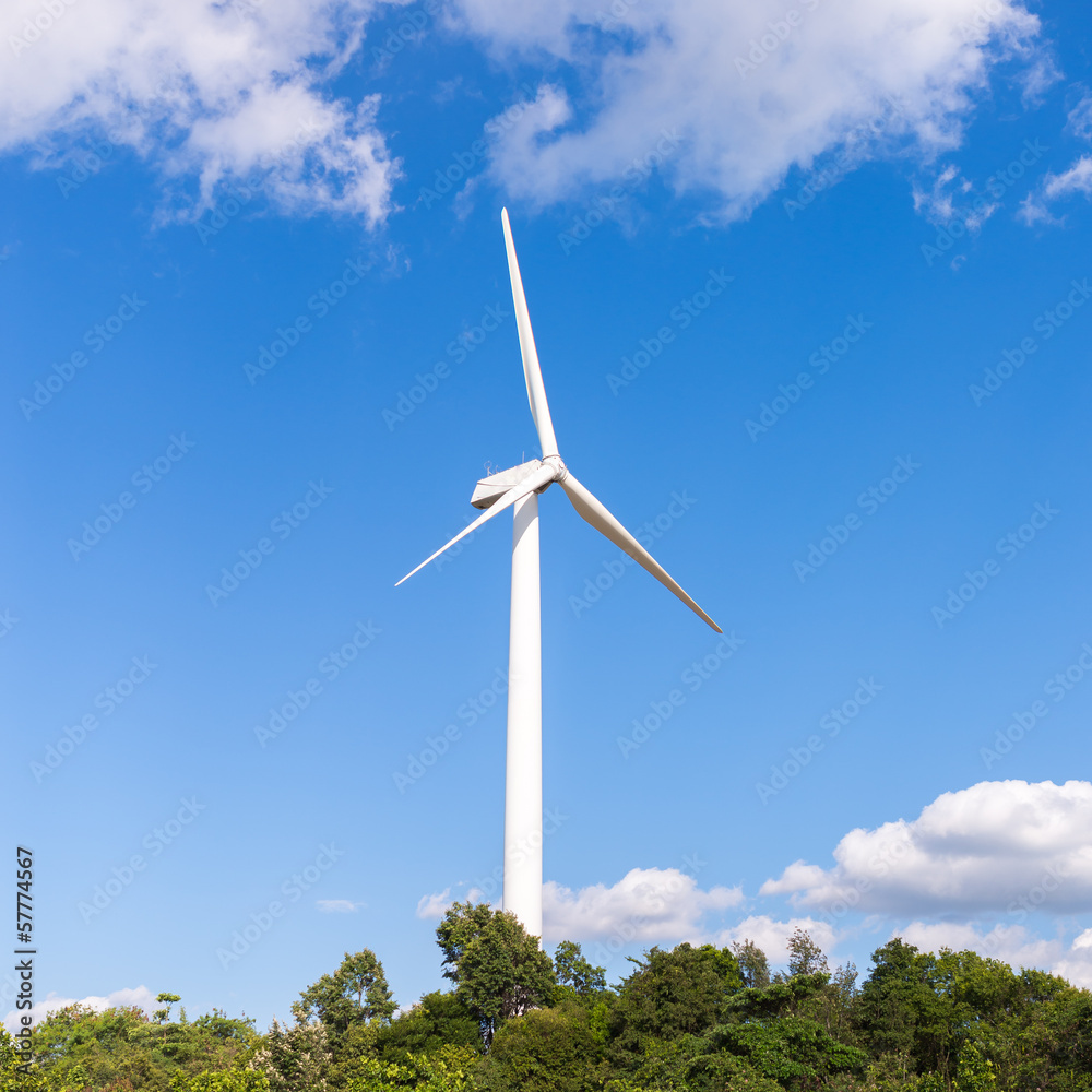 White electric wind mill with clear blue sky