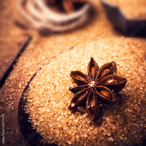 Baking ingredients Cinnamon sticks,  star anise and cane brown s photo