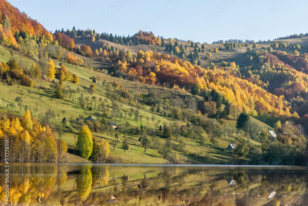Reflection in lake - autumn hills in Transylvania