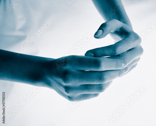 woman is doing massage hands on a light background