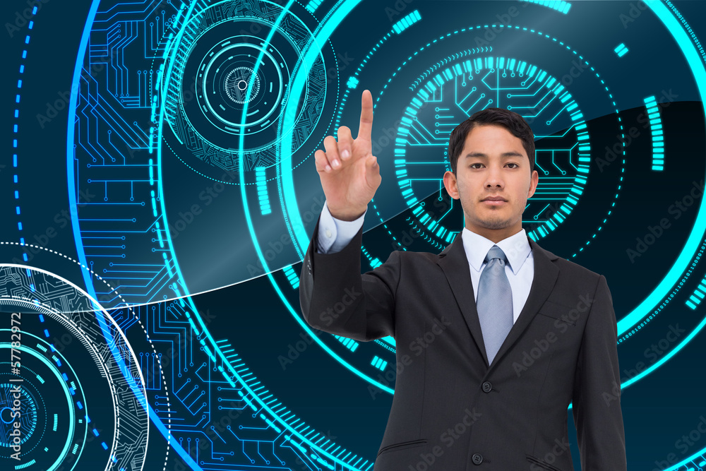 Composite image of serious asian businessman pointing Composite image of serious asian businessman pointing