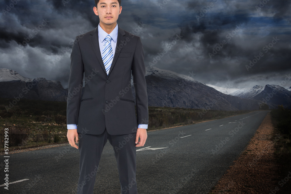 Composite image of serious asian businessman Composite image of serious asian businessman