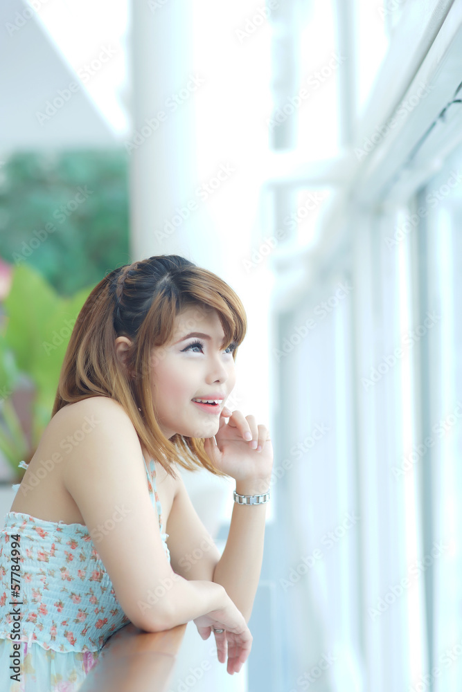 Young beautifull woman stand near glass wall in office Young beautifull woman stand near glass wall in office