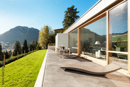 Beautiful modern house in cement, view from the garden