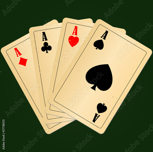 Four aces on green background