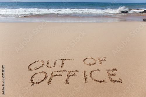 Out of office. Concept image in the sand on Hawaii beach.