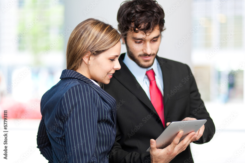 Business people using a tablet Business people using a tablet