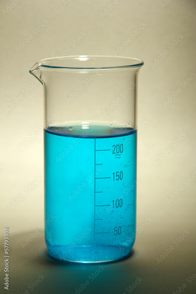 test-tube with blue liquid on grey background test-tube with blue liquid on grey background