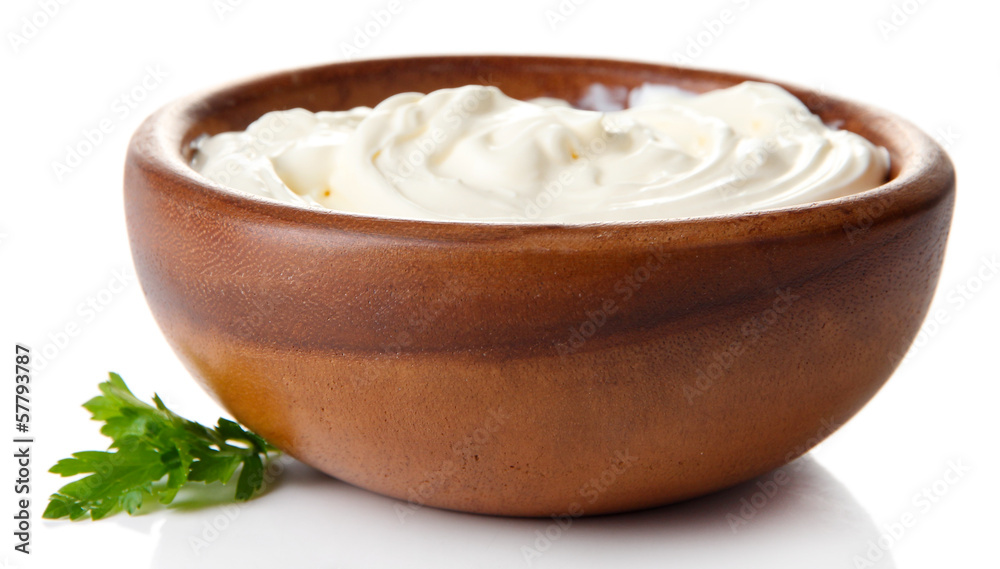 Sour cream in bowl isolated on white Sour cream in bowl isolated on white