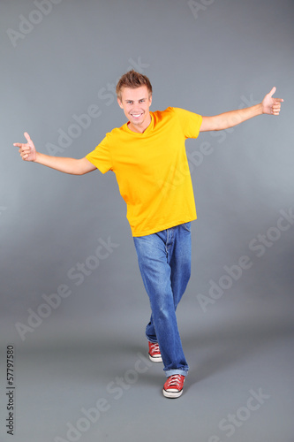 Handsome young man dancing ...