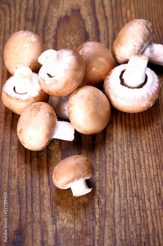 Brown mushroom on wood background