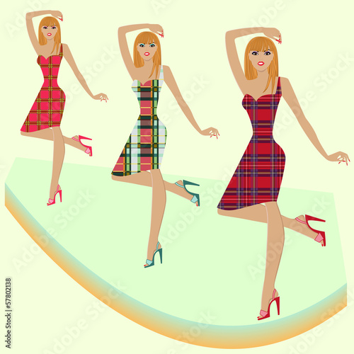 Fashion models posing on podium in various checkered dresses