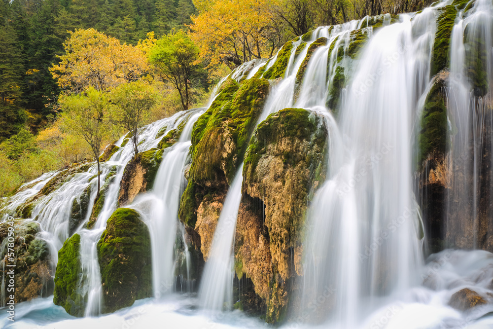 beautiful waterfall in colorful autumn