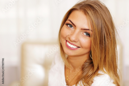 Closeup portrait of a young cheerful woman