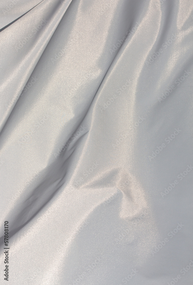 Fototapeta premium White sunlit fabric in the wind