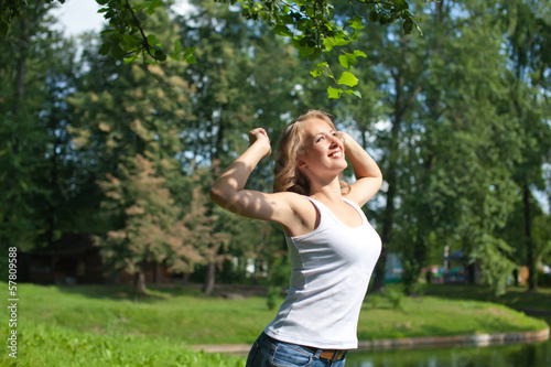 girl  doing exercises in the park © evasilchenko