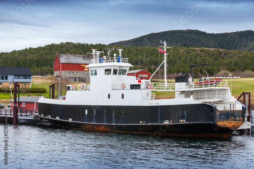 White passenger ferry with black hull stands moored