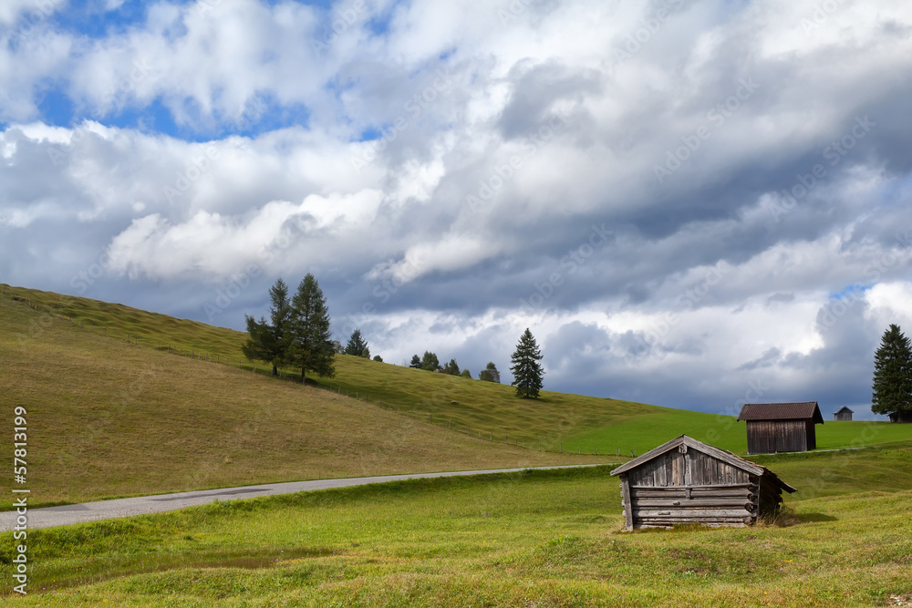 wooden hut on alpine meadow wooden hut on alpine meadow