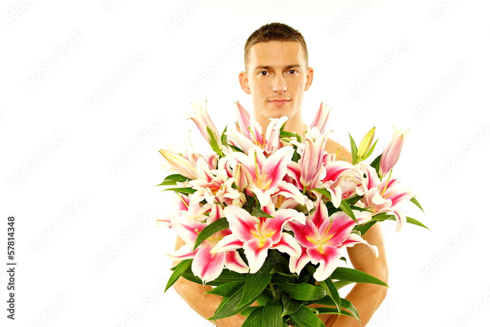 Young man shirtless holding flowers in arms. Young man shirtless holding flowers in arms.