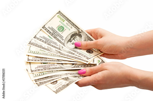Woman’s hands holding 100 US dollar banknotes